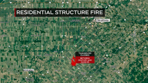 Residential structure fire prompts road closure