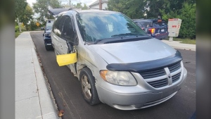 Driver flees collision with a bumper lodged in the side of his car