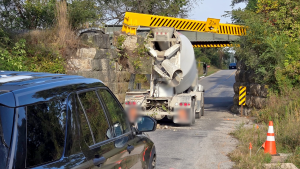 Truck wedged beneath CN train bridge shutters road south of Komoka