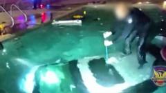 Police bodycam shows man being rescued from submerged car