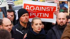 Russia’s opposition takes to the streets of Berlin