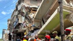 ‘My mother is still trapped after Tanzania building collapse’