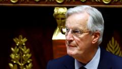 French government teeters after PM Barnier forces through budget