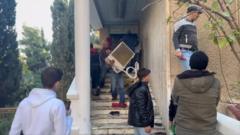 Watch: BBC sees looting at Bashar al-Assad’s residence