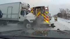 Incredible escape as lorry smashes fire truck on icy US highway