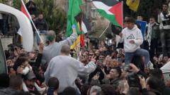 West Bank celebrations as freed Palestinian prisoners return