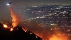 Fires reach Hollywood with fears iconic sign could be at risk