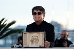 Iran’s Palme d’Or-winning director cheered as he arrives home