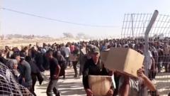 Crowds overrun US-backed group’s new aid distribution site in Gaza