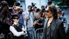 Russell Brand pleads not guilty to rape and assault