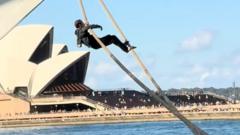 Watch: Man tries to scale cruise ship in Sydney