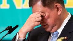 Japan’s ruling party set to lose majority, exit polls suggest