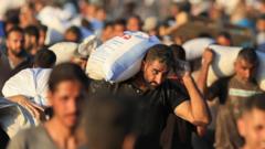 At least 30 killed by Israeli fire while waiting for aid, Gaza civil defence ministry says