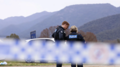 Australia police shooting suspect named as manhunt continues