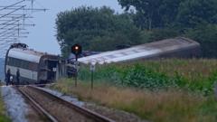 One dead and dozens injured as Danish train hits tanker and derails