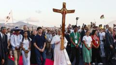 Pope greeted by vast crowd at Catholic youth event