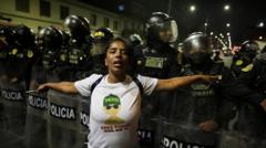 Young Peruvians clash with police in anti-government protests
