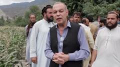 Afghan quake victims buried on mountain top as aftershocks continue