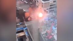 Moment sinkhole pulls down power lines in busy Bangkok street