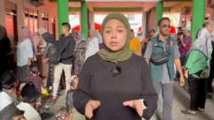 Watch: One street away from collapsed school as relatives wait for news