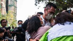 ‘Hang in there’: Agonising wait for the missing after Hong Kong blaze