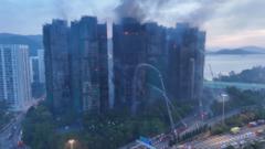 Watch: Dawn aerial footage reveals scale of Hong Kong apartment blaze