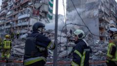 Massive Russian strikes across Ukraine leave one dead, officials say