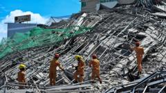 People trapped under collapsed building in Philippines