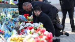 Kyiv bridge hit in further Russian drone attack as German chancellor makes surprise visit